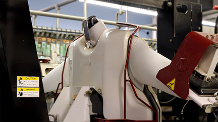 precision shirt pressing machine in action